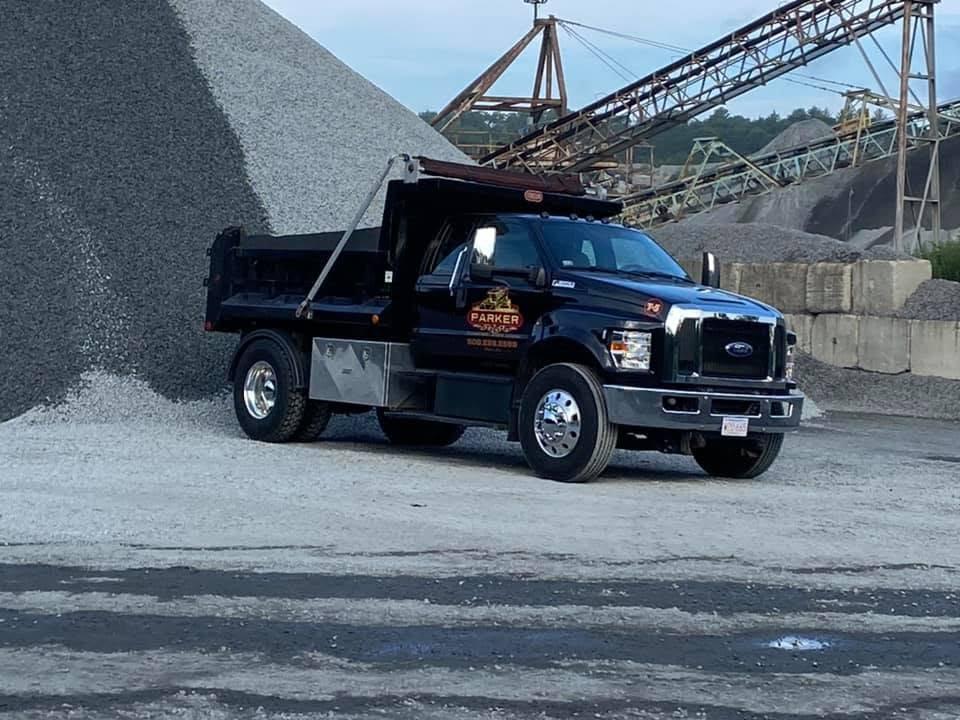 Branded Parker dump truck staged at an aggregate yard